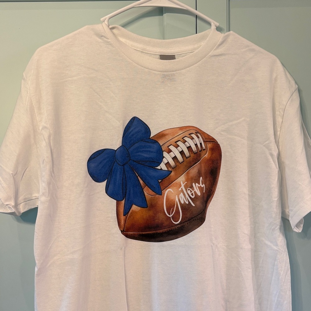 White Gators T-Shirt with Football and Blue Bow Design
